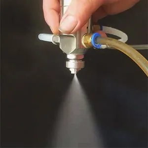 Air atomizing spray nozzle
