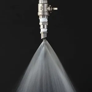 Spiral anti-clogging spray nozzle